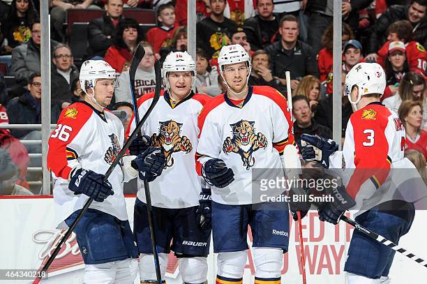 Jussi Jokinen of the Florida Panthers celebrates with teammates Aleksander Barkov, Alex Petrovic and Steven Kampfer after scoring against the Chicago...