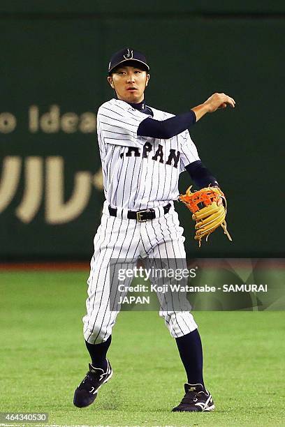 Ryosuke Kikuchi of Samurai Japan throws during the game three of Samurai Japan and MLB All Stars at Tokyo Dome on November 15, 2014 in Tokyo, Japan.