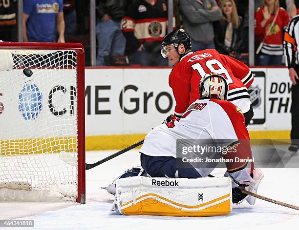 Jonathan Toews of the Chicago Blackhawks watches his shootout goal sail over Roberto Luongo of the Florida Panthers at the United Center on February...