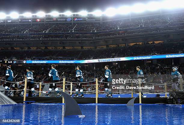 The San Jose Sharks take the field for warm ups before playing against the Los Angeles Kings in the 2015 Coors Light NHL Stadium Series game at...