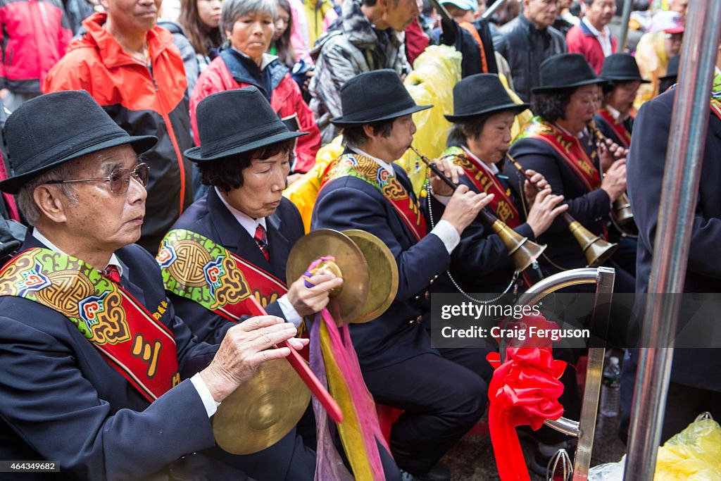 Temple musicians play their instruments at a traditional...