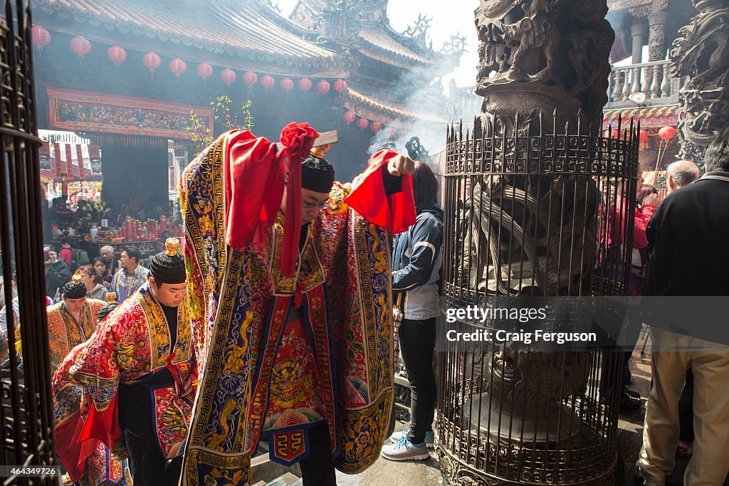 Taoist priests enter the temple's main shrine during rituals...