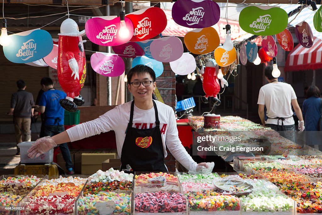 A vendor at the Jelly Belly candy stall displays the treats...