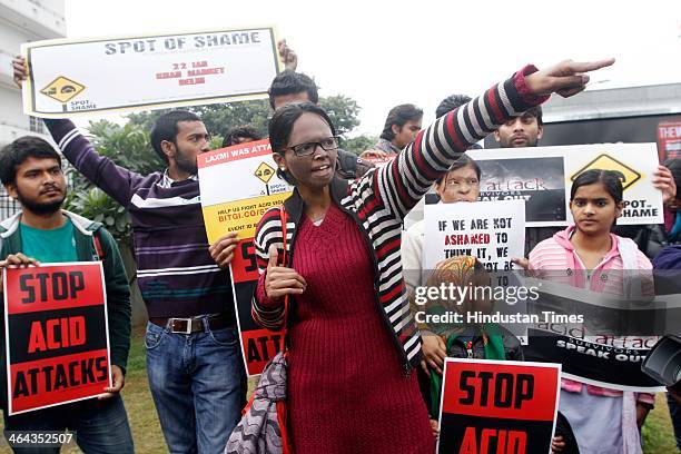 Acid attack victim Laxmi and other volunteers mobilizing support against acid attacks on January 22, 2014 in New Delhi, India. Laxmi is hoping to...