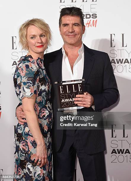 Editor-in-chief Lorraine Candy and Simon Cowell, winner of the Outstanding Contribution to Entertainment, pose in the Winners Room at the Elle Style...