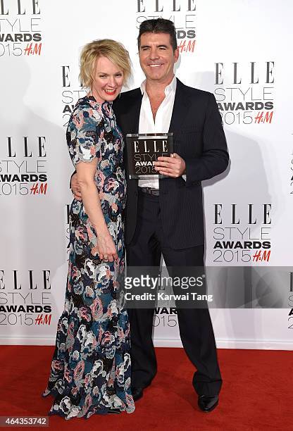 Editor-in-chief Lorraine Candy and Simon Cowell, winner of the Outstanding Contribution to Entertainment, pose in the Winners Room at the Elle Style...