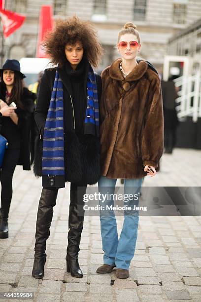 Models Bianca Gittens and Eve Delf exit the Emilio De La Morena show during London Fashion Week Fall/Winter 2015/16 at Somerset House on February 24,...