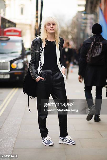 Model Aly Turska wears Zara, Adidas sneakers, Off White backpack, and Mo&Co white cardigan during London Fashion Week Fall/Winter 2015/16 at Somerset...
