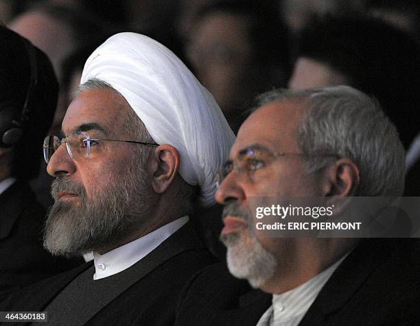 Iranian President Hassan Rouhani sits next to Iranian Foreign Minister Mohammad Javad Zarif during the World Economic Forum in Davos on January 22,...