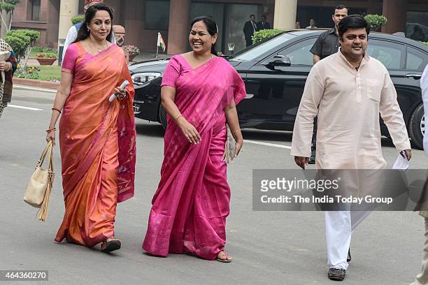 Hema Malini and Dharmendra Singh leaving the Parliament annex after the BJP's Parliamentary Board Meeting on day two of the Budget session of...