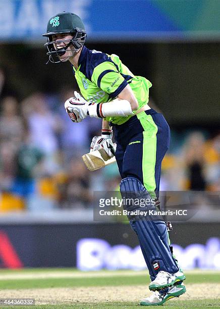 George Dockrell of Ireland celebrates victory after the 2015 ICC Cricket World Cup match between Ireland and the United Arab Emirates at The Gabba on...