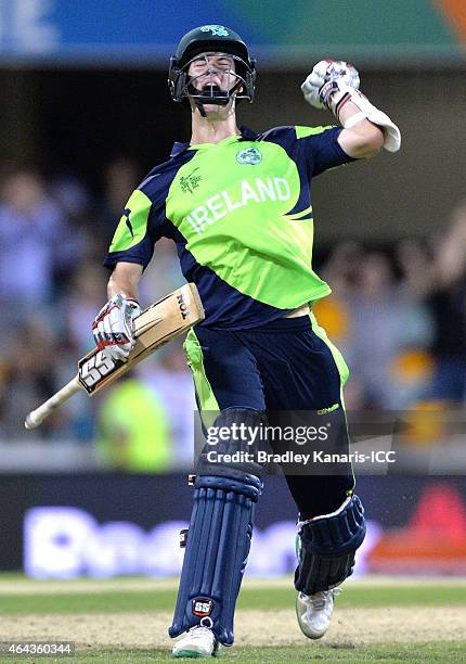 George Dockrell of Ireland celebrates victory after the 2015 ICC Cricket World Cup match between Ireland and the United Arab Emirates at The Gabba on...