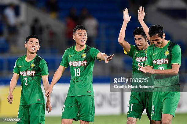 Li Yunqiu, Yu Dabao, Zhao Hejing and Shao Jiayi of Beijing Guoan celebrate victory during the AFC Asian Champions League match between Brisbane Roar...