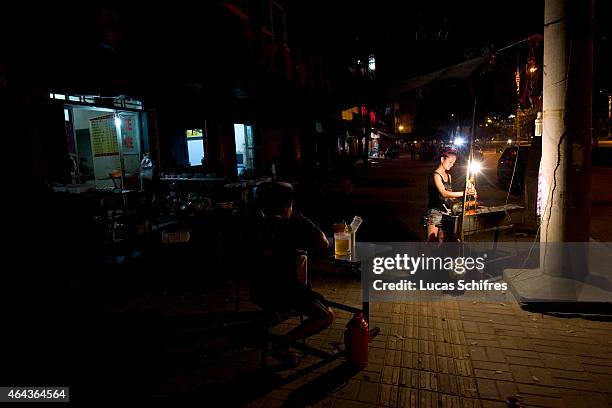 July 22: A street meatstick vendor on July 22, 2011 in Xiaogan, Hubei province, China.