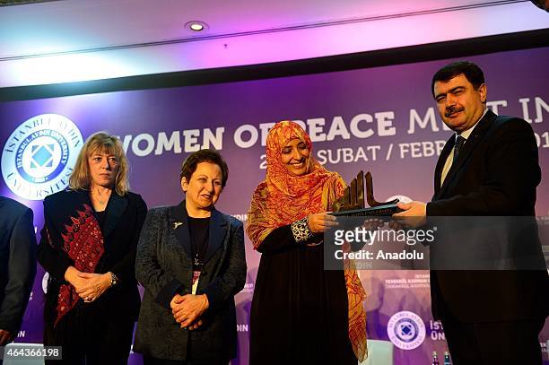 Istanbul Governor Vasip Sahin presents a gift to Nobel Peace Prize 2011 Winner Tawakkul Karman during the Peace in the Middle East conference under...