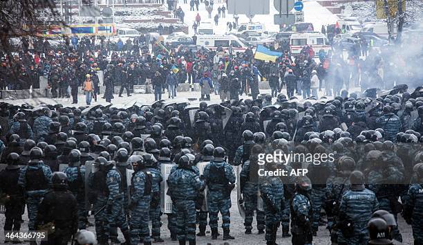 Protesters clash with police in the center of Kiev on January 22, 2014. Ukrainian police on Wednesday stormed protesters' barricades in Kiev amid...