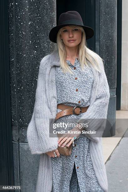 Jewellery designer Yana Raskovalova wears a Dior jacket, Ulyana Sergeenko dress and bag and a Maison Michel hat day 2 of Paris Haute Couture Fashion...