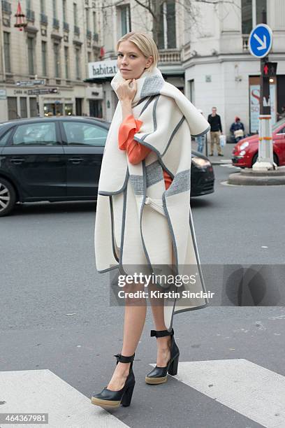 Model Elena Perminova wears Chloe shoes, dress and jacket day 2 of Paris Haute Couture Fashion Week Spring/Summer 2014, on January 21, 2014 in Paris,...