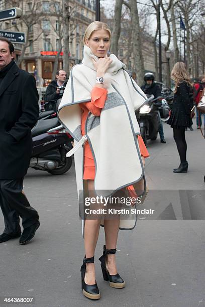 Model Elena Perminova wears Chloe shoes, dress and jacket day 2 of Paris Haute Couture Fashion Week Spring/Summer 2014, on January 21, 2014 in Paris,...