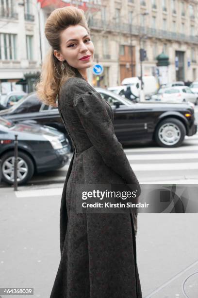 Artist Lidia Metelskaya wears a Ulyana Sergeenko dress and vintage bag day 2 of Paris Haute Couture Fashion Week Spring/Summer 2014, on January 21,...