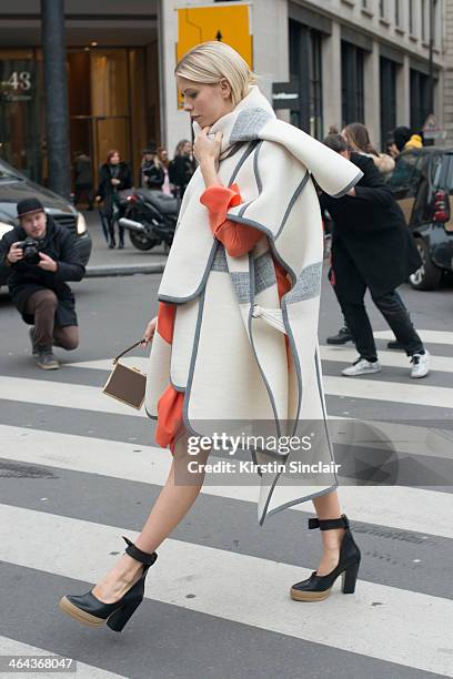 Model Elena Perminova wears Chloe shoes, dress and jacket day 2 of Paris Haute Couture Fashion Week Spring/Summer 2014, on January 21, 2014 in Paris,...