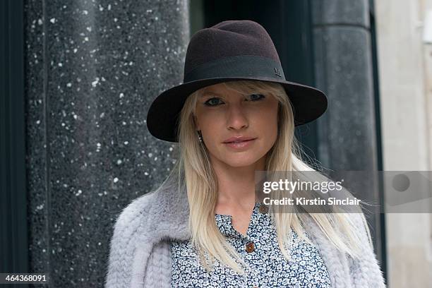 Jewellery designer Yana Raskovalova wears a Dior jacket, Ulyana Sergeenko dress and a Maison Michel hat day 2 of Paris Haute Couture Fashion Week...