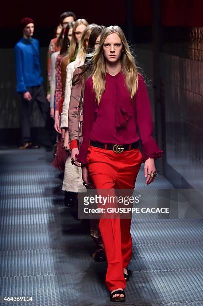 Models present creations for fashion house Gucci at the women Fall / Winter 2015/16 Milan's Fashion Week on February 25, 2015 in Milan. AFP PHOTO /...
