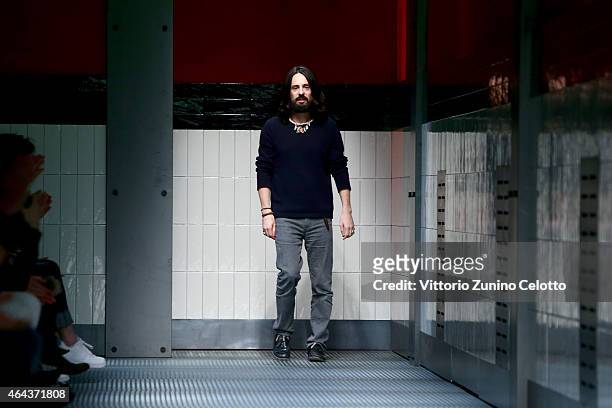Designer Alessandro Michele acknowledges the applause of the audience after the Gucci show during the Milan Fashion Week Autumn/Winter 2015 on...