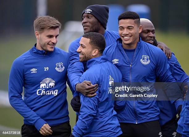 Aaron Lennon of Everton is hugged by teammmates Luke Garbutt, Romelu Lukaku and Tyias Browning during a training session at Finch Farm on February...