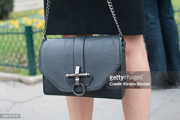 Fashion editor for Vogue Turkey, Ece Sukan wears a Givenchy bag day 2 of Paris Haute Couture Fashion Week Spring/Summer 2014, on January 21, 2014 in...