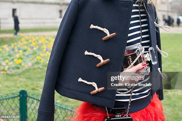 Fashion photographer Zhanna Romashka wears a Chanel bag day 2 of Paris Haute Couture Fashion Week Spring/Summer 2014, on January 21, 2014 in Paris,...