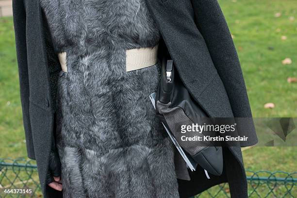 Creative director of Harpers Bazaar Singapore, Kenneth Goh wears a Givenchy coat, Bally clutch bag day 2 of Paris Haute Couture Fashion Week...