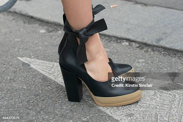 Model Elena Perminova wears Chloe shoes day 2 of Paris Haute Couture Fashion Week Spring/Summer 2014, on January 21, 2014 in Paris, France.