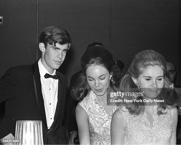 David Eisenhower, his wife, Julie, and Tricia Nixon are in the swing at Young America Miniball at Washington Hilton. Tricia presided over the ball...