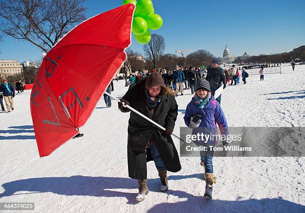 Regina Hiney of Fredericksburg, Va., and her daughter Mary make their way to a rally on the Mall for the March for Life anti-abortion demonstration.