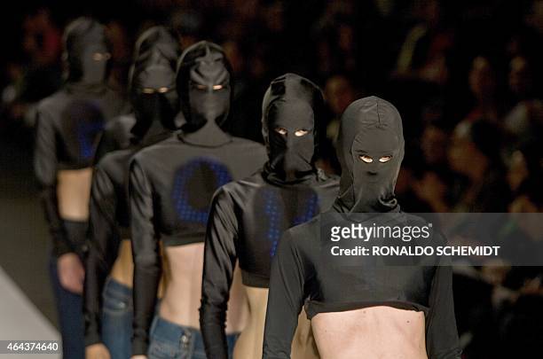 Models display a creations by Lycra during the Fashion Week in Mexico City on October 22, 2008. AFP PHOTO/Ronaldo SCHEMIDT