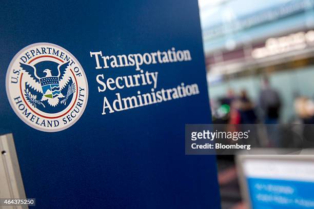 Transportation Security Administration sign stands at Ronald Reagan National Airport in Washington, D.C., U.S., on Wednesday, Feb. 25, 2015....