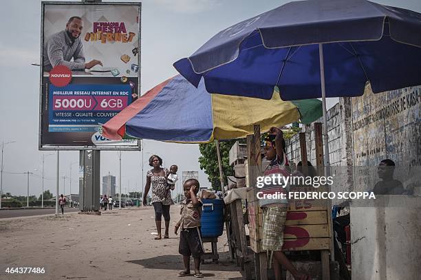 Billboard features an advertising for internet promotions for social networks on February 25, 2015 in Kinshasa. Sales are down and business is slow...