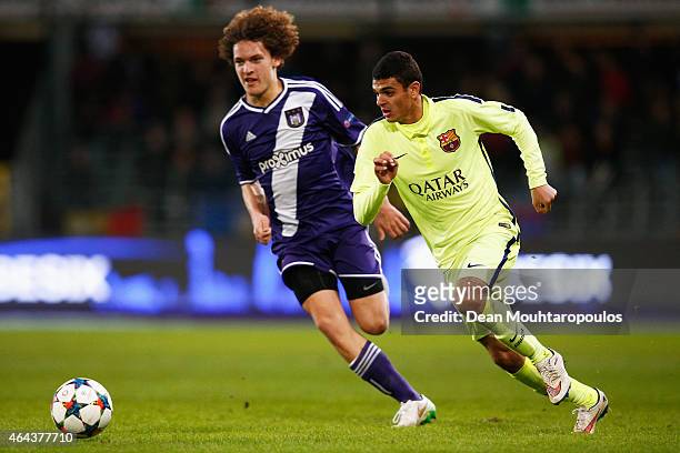 Mohamed El Ouriachi of Barcelona gets past Wout Faes of Anderlecht during the UEFA Youth League Round of 16 match between RSC Anderlecht and FC...