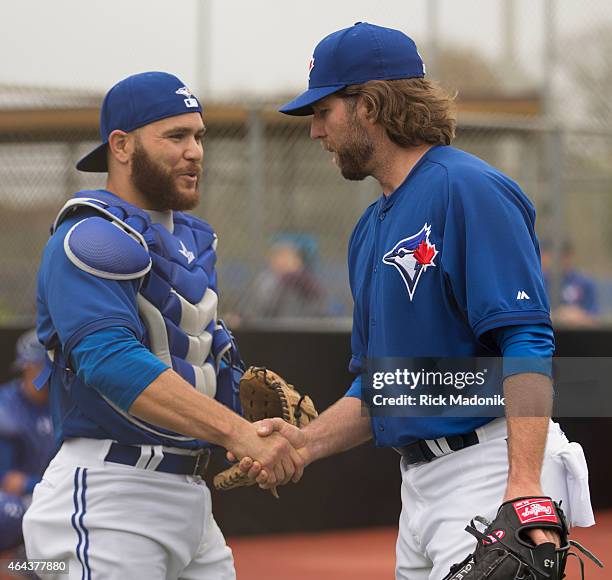 Catcher Russell Martin and pitcher RA Dickey shake hands following their morning work in the bullpen. The team worked out at the Bobby Mattock...