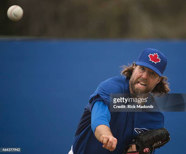 Pitcher RA Dickey works the bullpen with catcher Russell Martin. The team worked out at the Bobby Mattock Training Facility in Dunedin as the Jays...