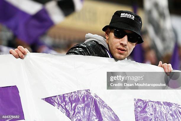 Anderlecht fan holds a sign prior to the UEFA Youth League Round of 16 match between RSC Anderlecht and FC Barcelona held at Constant Vanden Stock...