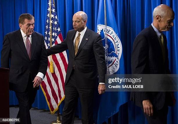 Secretary of Homeland Security Jeh Johnson, alongside former Homeland Security Secretaries Tom Ridge and Michael Chertoff leave after speaking about...