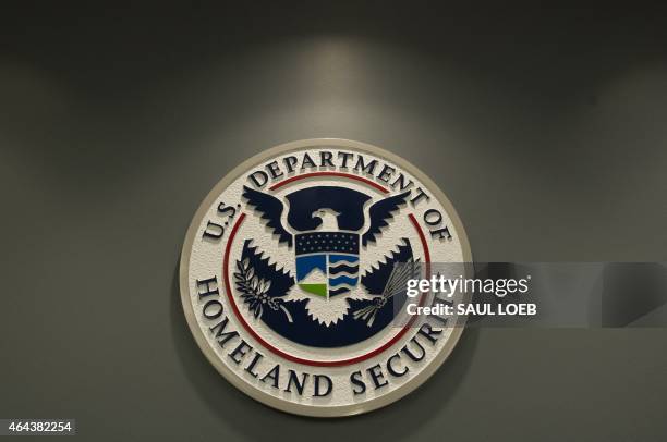 The seal of the Department of Homeland Security is seen at US Immigration and Customs Enforcement in Washington, DC, February 25, 2015. AFP PHOTO /...