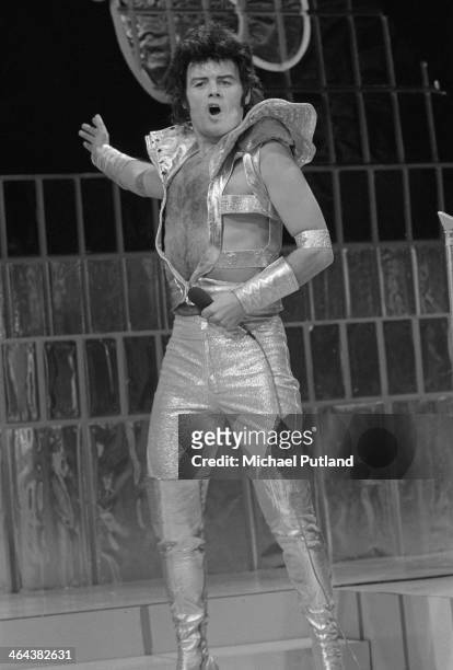 British glam rock singer Gary Glitter performing with the Glitter Band on the Christmas Day edition of the BBC TV music show 'Top Of The Pops',...