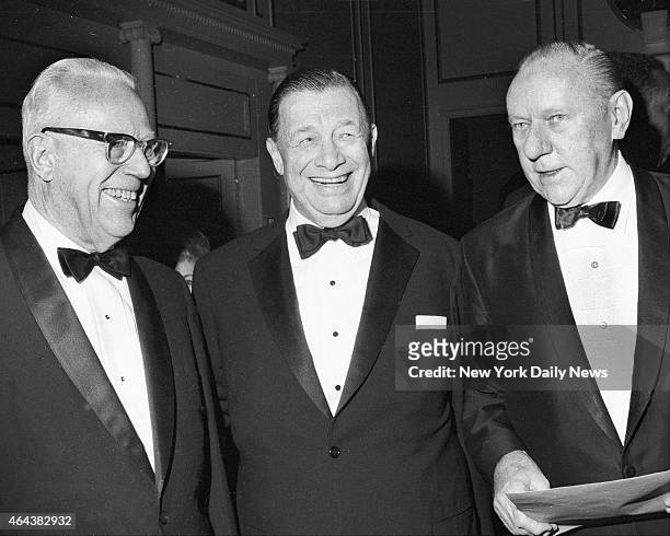 Ex-Chief Justice Earl Warren and columnist Bob Considine greet Toots Shor as he was honored at Hilton Hotel.