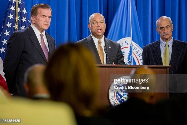 Jeh Johnson, U.S. Secretary of Homeland Security , center, speaks during a news conference with former secretaries of Homeland Security Tom Ridge,...