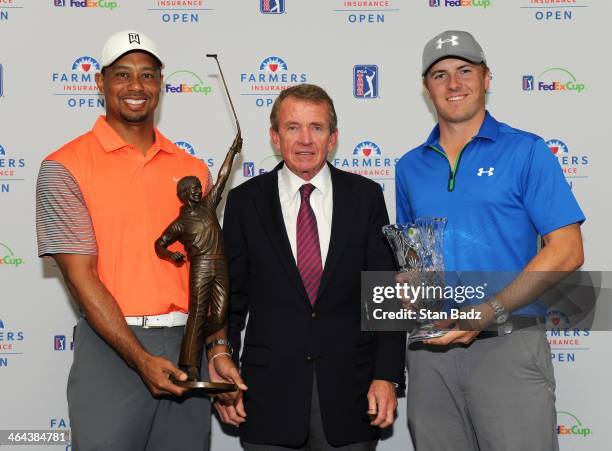 Player of the Year recipient Tiger Woods with the Jack Nicklaus Trophy, PGA TOUR Commissioner Tim Finchem, and Rookie of the Year recipient Jordan...