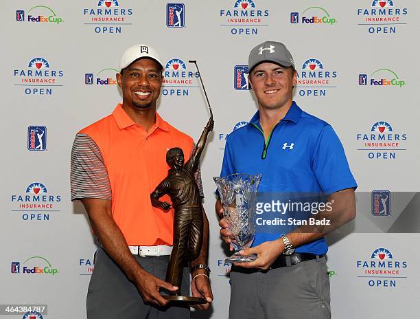Player of the Year recipient Tiger Woods with the Jack Nicklaus Trophy and Rookie of the Year recipient Jordan Spieth pose for a photo at the Farmers...