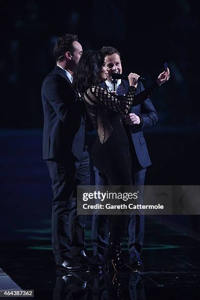 Ant and Dec on stage with Kim Kardashian West during the BRIT Awards 2015 at The O2 Arena on February 25, 2015 in London, England.